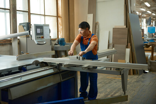 Craftsman carefully operates cutting devices to ensure flawless results safely