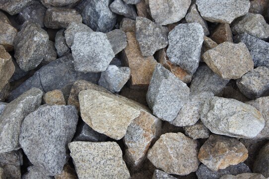 Full frame top view texture background of grey crushed granite stone gravel for construction and landscape design.