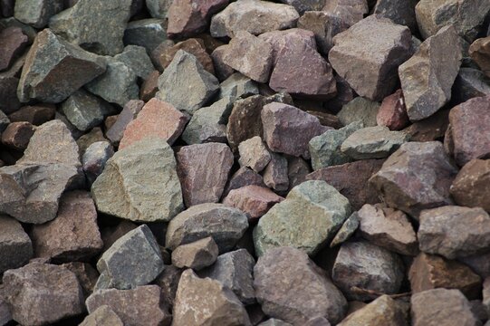 Full frame top view texture background of grey crushed granite stone gravel for construction and landscape design.