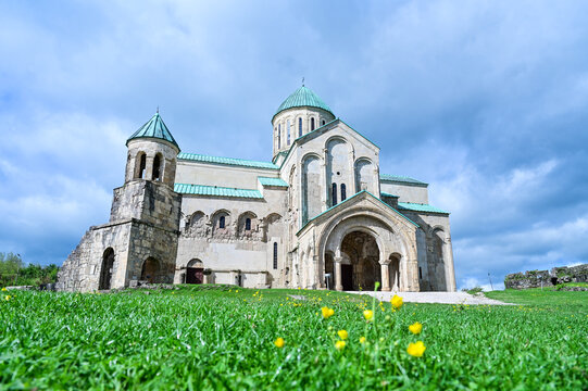 Medieval Bagrati Cathedral with a green domed roof and bell tower on Ukimerioni Hill above the city of Kutaisi, Imereti region, Georgia