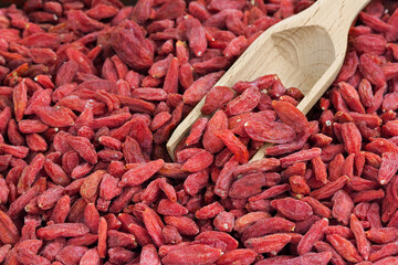 Goji berry with wood scoop - closeup © Siyue