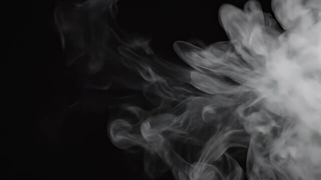 White smoke plume expanding in darkness with cinematic motion and subtle diffusion