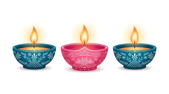 Three colorful traditional clay diya lamps with glowing flames isolated on a white background for the beautiful indian festival of lights called diwali