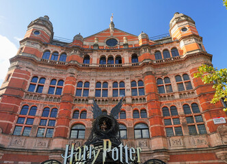 Fototapeta premium London, UK - October 28 2025: The Palace Theatre, a historic building known for its distinctive red-brick facade, currently home to the play Harry Potter and the Cursed Child
