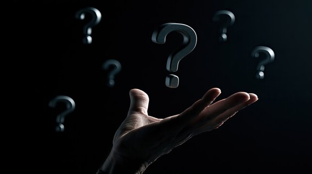 Hand Reaching Towards Floating Question Marks in Darkness.