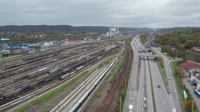 Stationary Freight Wagons at Savenas Railway Yard and E20 Highway, Aerial