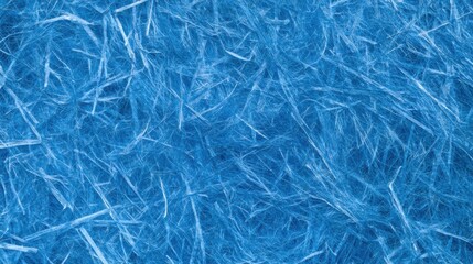 Obraz premium Blue recycled paper with visible fibers forming a tactile surface suitable for crafts and designs in a natural setting.