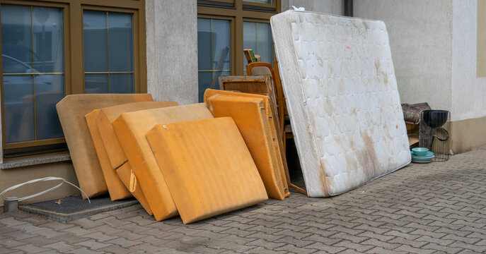 Bulky waste placed on the city sidewalk for collection and transport to the recycling facility.