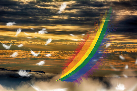 3D illustration LGBTQ rainbow flag on a feathers fluttering in the sky. Freedom and love concept. Activism, community and freedom concept.