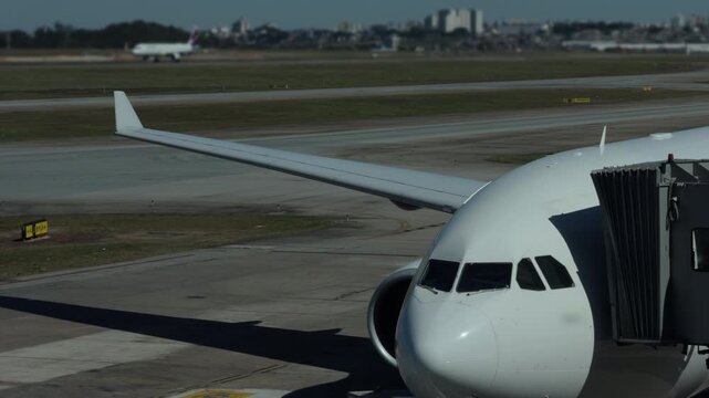 Aircraft Nose Docked at Guarulhos Airport Terminal