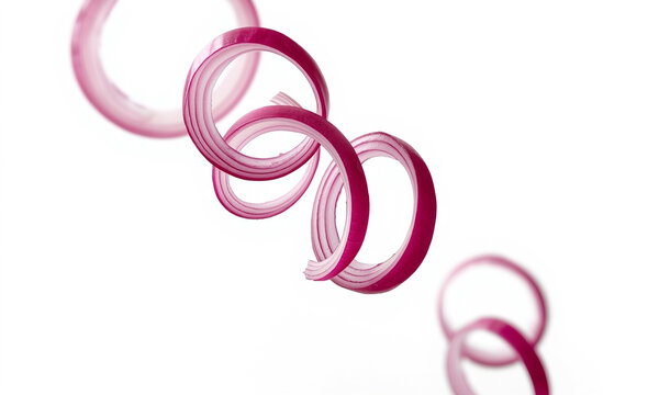 Red onion spiral rings slice gracefully for salad design.