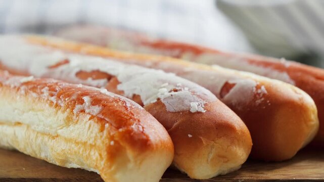 Close-up of traditional Fartons, elongated glazed pastries from Valencia, Spain, a popular sweet served with horchata. High quality 4k footage