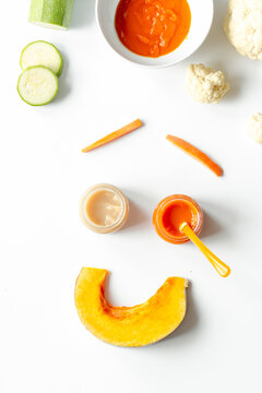 cooking vegetable puree for baby on white background top view