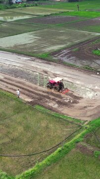 Vertical Aerial View of Indian Farmers Preparing Paddy Fields in Rural India