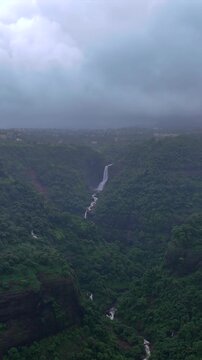 Vertical Aerial View of Lonavala Waterfall and Misty Green Hills During Monsoon Maharashtra