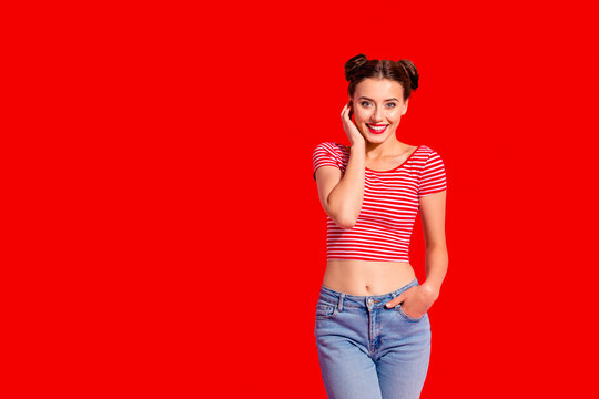 Portrait of her she nice cute charming attractive lovely shine adorable sweet winsome fascinating cheerful girl wearing striped t-shirt jeans isolated on pink pastel background