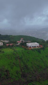 Vertical Aerial View of Lonavala Waterfall and Misty Green Hills During Monsoon Maharashtra
