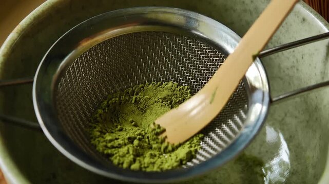 Barista preparing traditional matcha using setting. The scene highlights the careful preparation process, vibrant green matcha, and Japanese-inspired tea culture, making it suitable for beverage, caf&eacute;