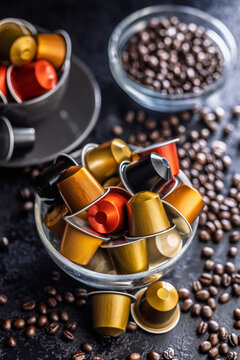Colorful Coffee Capsules And Coffee Beans In Glass Bowls With Espresso Pods For Home Brewing