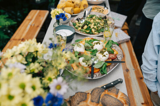 High angle view of delicious caprese salad served on dining table in back yard