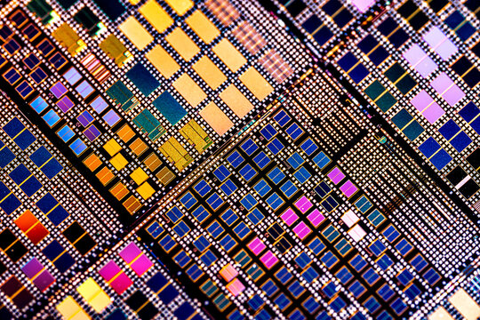 Silicon semiconductor wafer with integrated circuit die mosaic pattern.