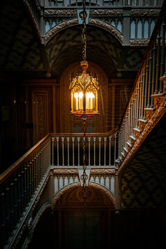 Elegant Vintage Gothic Staircase with Glowing Ornate Lantern.