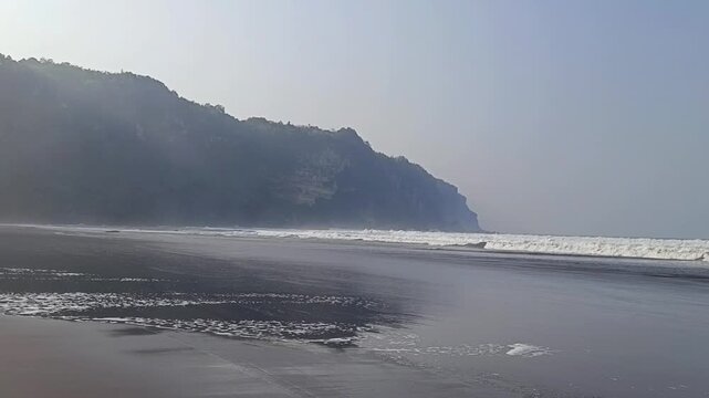 Video footage of the gently sloping black-sand beach at Parangtritis, Yogyakarta.