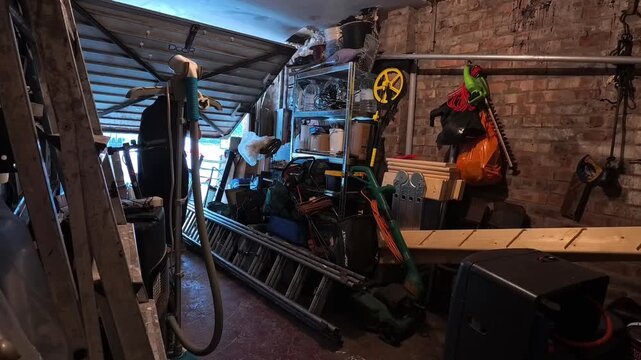 Time lapse male arranging messy garage space dealing with storage and clutter
