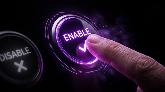 Hand pressing glowing enable button on digital interface for activation and security settings