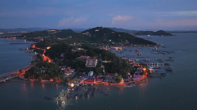 An aerial view of Koh Yor island in Songkhla province during a vibrant sunset.