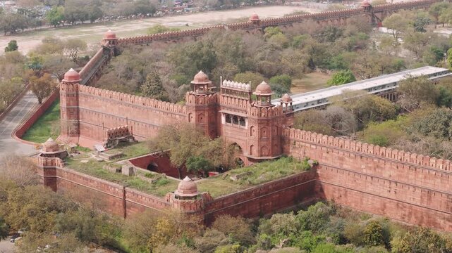 Aerial view of the historic red fort in delhi with its massive red sandstone walls and ancient fortifications in india