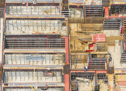Aerial view of building formwork construction with metal supports and structural framing at a construction site in Taiwan.