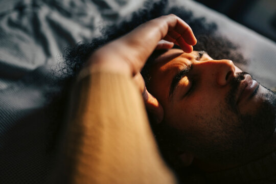 Frustrated man touching his forehead due to extreme mental pressure