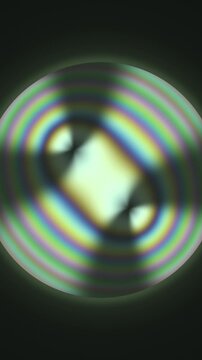 Conoscopic Interference Figure With Swinging Isogyre Brushes In Polarized Light Seamless Loop in rich green tones vertical 9:16