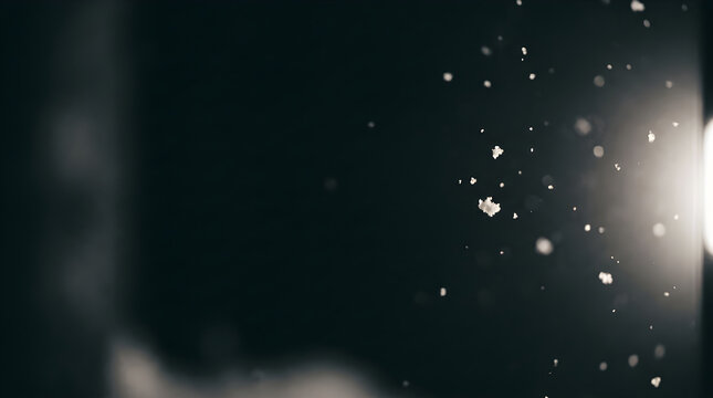 Atmosphere Concept with Dust Particles Floating in a Backlit Dark Indoor Environment