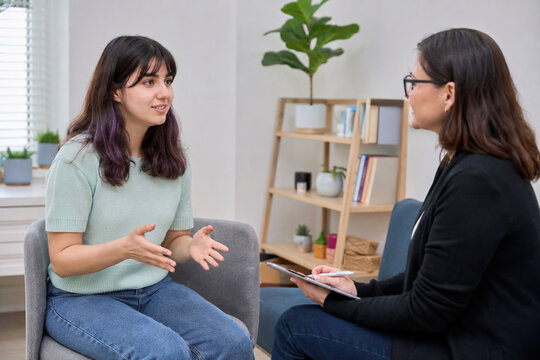 Supportive Speech Therapy Session with Young Adult Client, Photorealistic Communication Healthcare Image for Stuttering Awareness and Inclusive Education