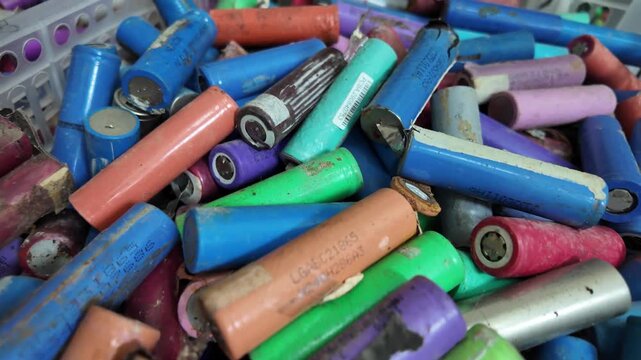 18650 lithium-ion battery cells ready for recycling and processing. Electronic waste (e-waste), sustainable energy management, and battery reuse initiatives