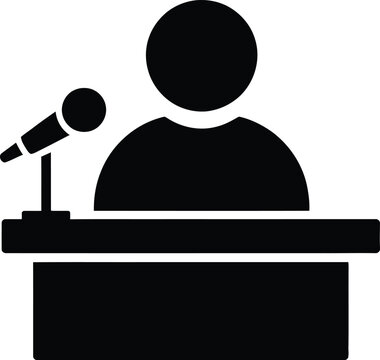 Black silhouette of a person standing behind a podium with a microphone, isolated on a white background, representing a public speaker, lecturer, or conference presenter