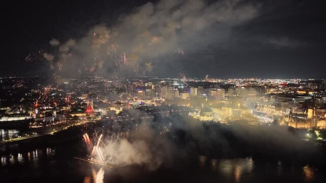 Ottawa, Canada, fireworks over Parliament Hill and the Ottawa River amid heavy smoke, haze and air pollution. g.