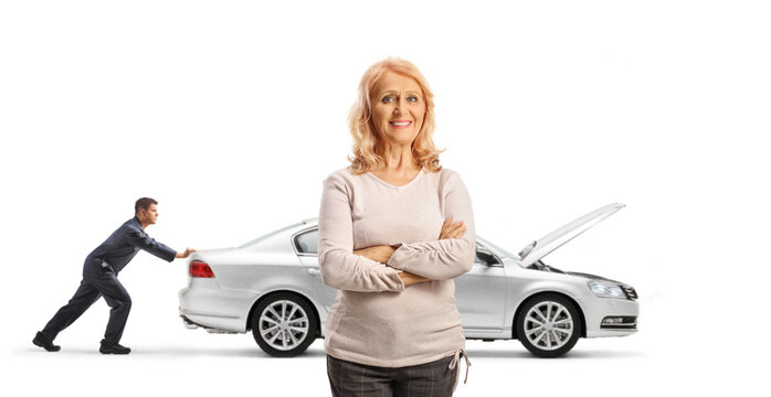 Mechanic helping a woman with a broken down car