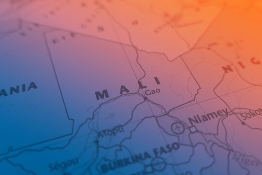 Map of Mali made in orange and blue gradient. Selective focus on label, close-up view