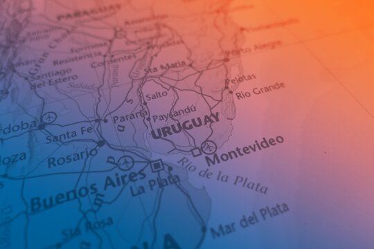 Map of Uruguay made in orange and blue gradient. Selective focus on label, close-up view