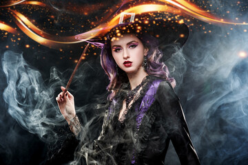 Glamorous witch casting a magic spell © Andrey Kiselev