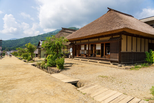 Historic streetscape of Ouchi-juku lined with traditional thatched-roof houses in Fukushima