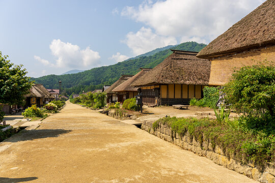 Historic streetscape of Ouchi-juku lined with traditional thatched-roof houses in Fukushima