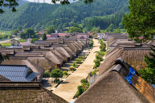 Historic streetscape of Ouchi-juku lined with traditional thatched-roof houses in Fukushima