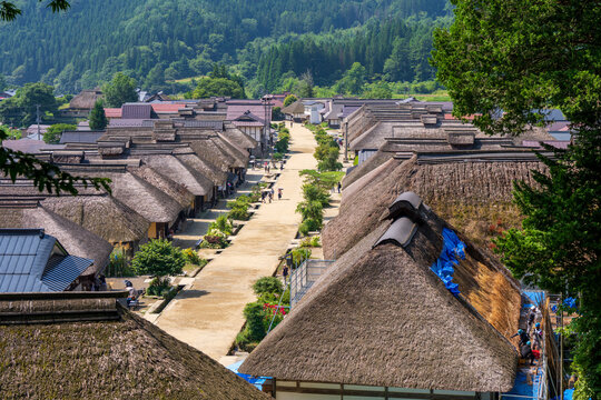 Historic streetscape of Ouchi-juku lined with traditional thatched-roof houses in Fukushima