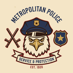 Fototapeta premium This striking emblem features an eagle with a police cap, crossed batons, and a shield. It symbolizes strength and protection by the Metropolitan Police established in 1920.