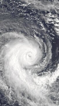 Panoramic shot on cyclone above ocean. Weather change, bad weather concept. Camera is zooming out. Vertical video. Animation based on image by NASA