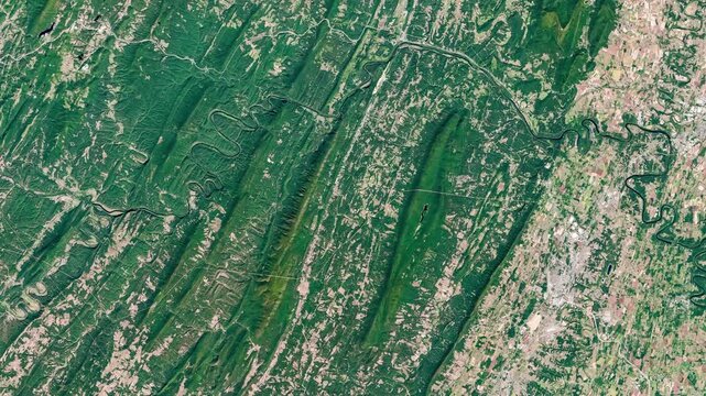 View from above on green and agricultural zone with meanders of rivers. Camera is moving right and up. Animation based on image by NASA